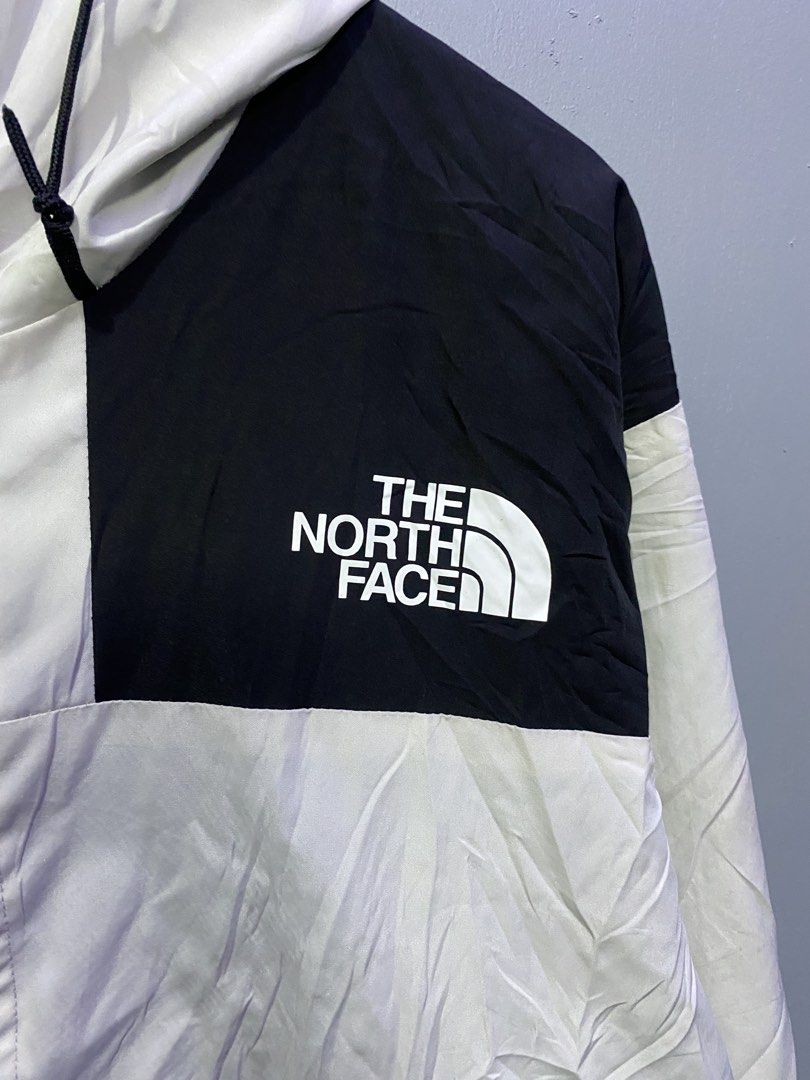 The North Face Black and White Mountain Jacket (Category: Coats, Jackets and Outerwear) located in Caloocan City. Submitted by retrowear.gallery (Listing ID 1469777343, Image 2). Description: - Brand: The North Face - Style: Mountain jacket in classic black and white colorblock - Size: Men's Medium (Made in Bangladesh) - Features: Breathable mesh lining, front zip closure with button flap overlay, adjustable drawstring hood, and durable YKK zippe