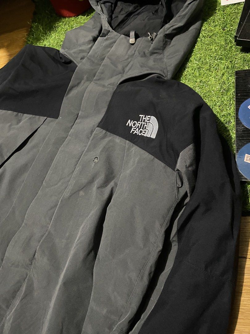 The North Face Gore-Tex XCR Jacket Grey Black (Category: Coats, Jackets and Outerwear) located in Baguio. Submitted by pickemup2600 (Listing ID 1469904798, Image 2). Description: - Brand: The North Face - Size: Large - Color: Grey and Black - Material: Gore-Tex XCR (100% waterproof) - Features: Built-in hood, mesh lining, dual zip and snap button closure - Details: Embroidered logos on chest and back shoulder - Condition: Clean outer shell, excel