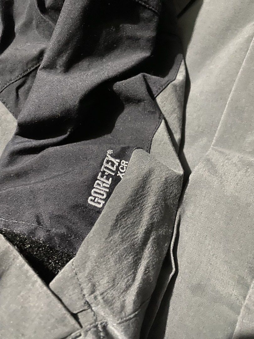The North Face Gore-Tex XCR Jacket Grey Black (Category: Coats, Jackets and Outerwear) located in Baguio. Submitted by pickemup2600 (Listing ID 1469904798, Image 3). Description: - Brand: The North Face - Size: Large - Color: Grey and Black - Material: Gore-Tex XCR (100% waterproof) - Features: Built-in hood, mesh lining, dual zip and snap button closure - Details: Embroidered logos on chest and back shoulder - Condition: Clean outer shell, excel