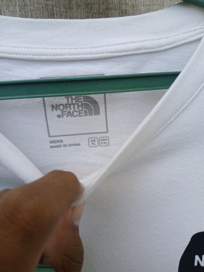The North Face Never Stop Exploring Van Graphic T-Shirt (Category: Tshirts & Polo Shirts ) located in Moalboal. Submitted by thrift_sixty (Listing ID 1469763799, Image 3). Description: - Brand: The North Face - Color: Crisp White - Size: XL US / XXL Asia - Material: 100% Cotton (Relaxed fit, very comfortable) - Design: Small chest logo on front, large retro yellow camper van with 'Never Stop Exploring' banner on the back - Condition: Clean fabric
