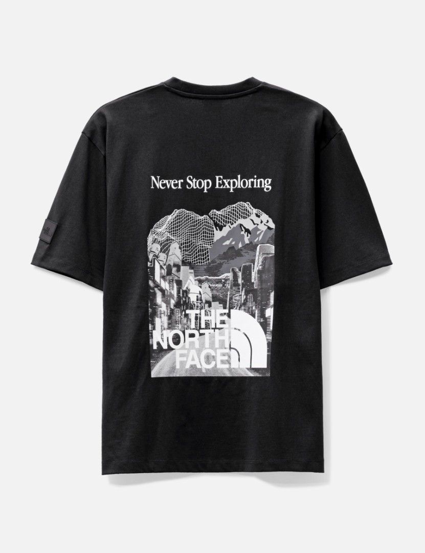 The North Face Never Stop Exploring Black Pocket T-Shirt (Category: Tshirts & Polo Shirts ) located in Manila. Submitted by christian_22 (Listing ID 1469857069, Image 1). Description: - Brand: The North Face - Color: Black - Size: Standard Fit (Large) - Material: Premium clean cotton - Design Details: Chest pocket with small logo hit, rubber brand patch on the left sleeve - Back Graphic: Large artistic mountain and city skyline print with 'Never 