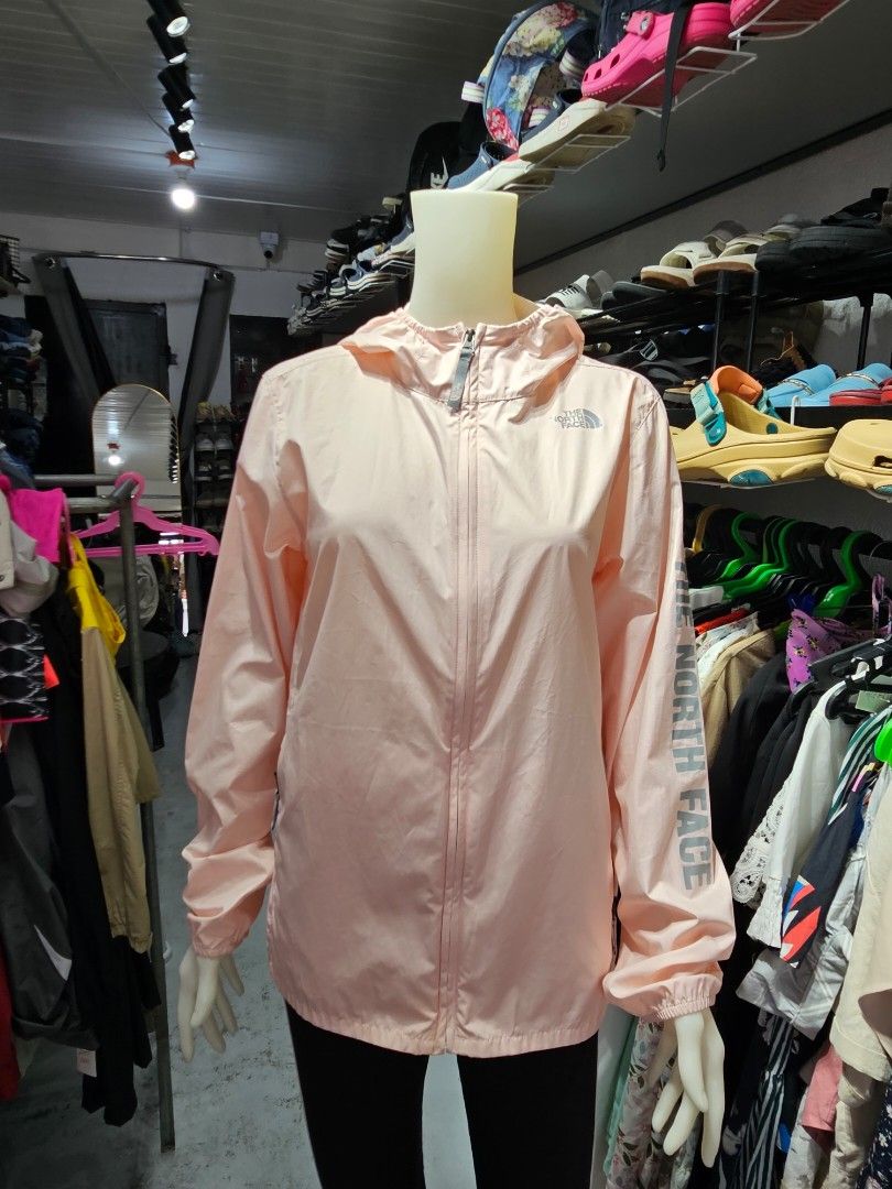 The North Face windbreaker jumper (Category: Coats, Jackets and Outerwear) located in Baguio. Submitted by kayeonlineshop (Listing ID 1469846539, Image 2). Description: light pink The North Face hooded windbreaker jacket featuring a full-zip front and a bold brand logo down the sleeve,.