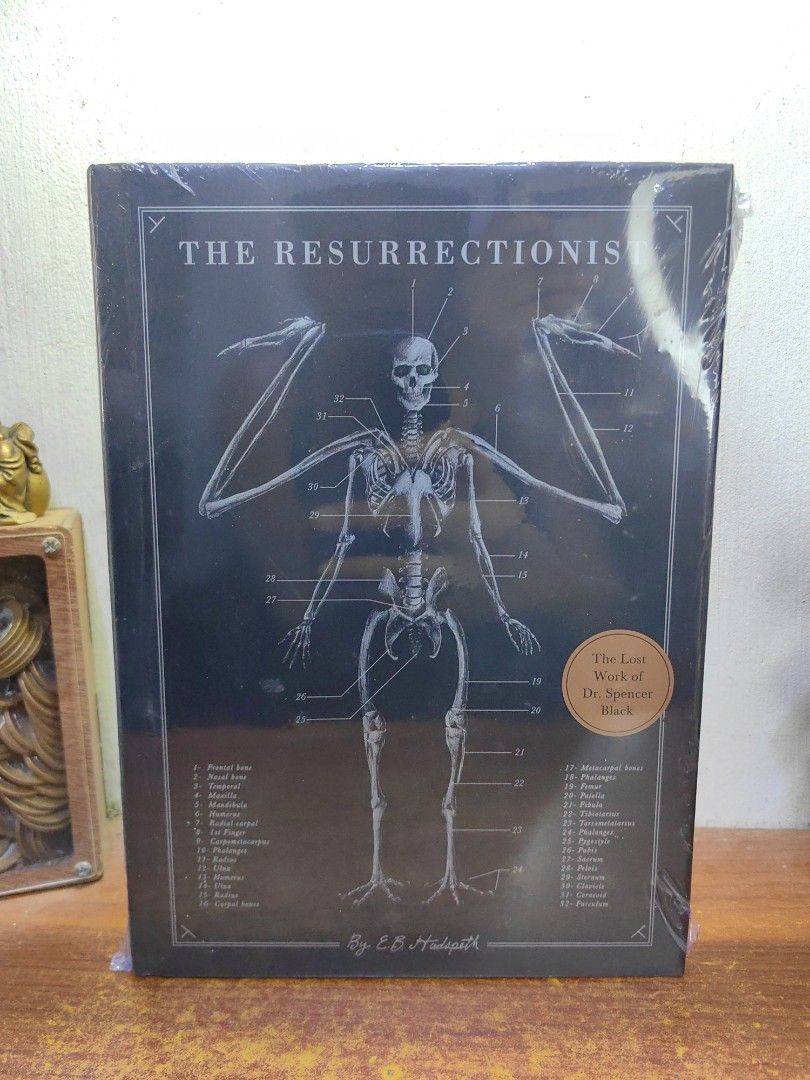 The Resurrectionist (Category: Everything Else Others) located in Tarlac. Submitted by chapterse7en (Listing ID 1469807853, Image 2). Description: IMPORTANT: Serious buyers only❗ Hassle to to transact with, lowballers, and unresponsive buyers who ghost the chat will be automatically BLOCKED Brandnew Large Hardcover Fullybooked Price is 1,550 2 copies available Mode of Payment : Gcash, Maya or Gotyme or Security Bank Mode of Delivery : J&T Locatio