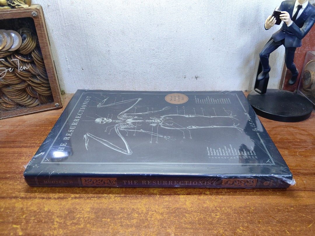 The Resurrectionist (Category: Everything Else Others) located in Tarlac. Submitted by chapterse7en (Listing ID 1469807853, Image 3). Description: IMPORTANT: Serious buyers only❗ Hassle to to transact with, lowballers, and unresponsive buyers who ghost the chat will be automatically BLOCKED Brandnew Large Hardcover Fullybooked Price is 1,550 2 copies available Mode of Payment : Gcash, Maya or Gotyme or Security Bank Mode of Delivery : J&T Locatio
