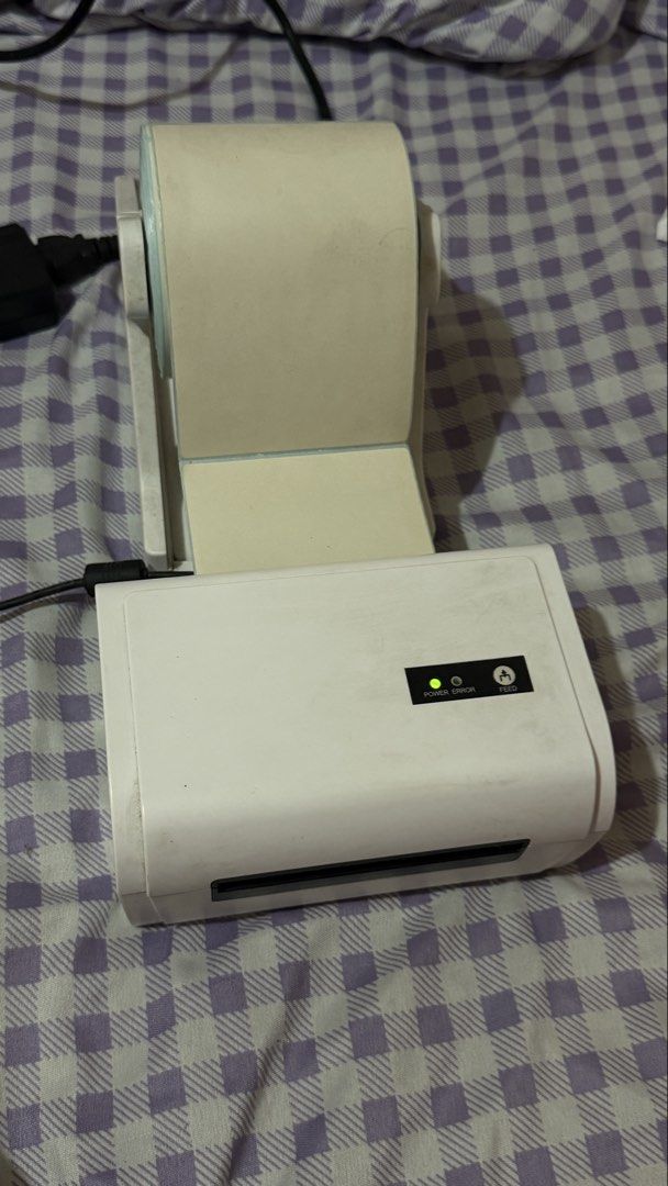 Thermal Label Printer with Manual and Driver CD (Category: Printers, Scanners & Copiers) located in Cavite. Submitted by jcai03 (Listing ID 1469823391, Image 1). Description: - Type: Desktop Thermal Label Printer (White) - Condition: Tested and working (Power light verified) - Ideal for: Shipping labels, barcodes, and product tags - Compatibility: Print easily from your phone or computer - Inclusions: Power adapter, instruction manual, driver ins