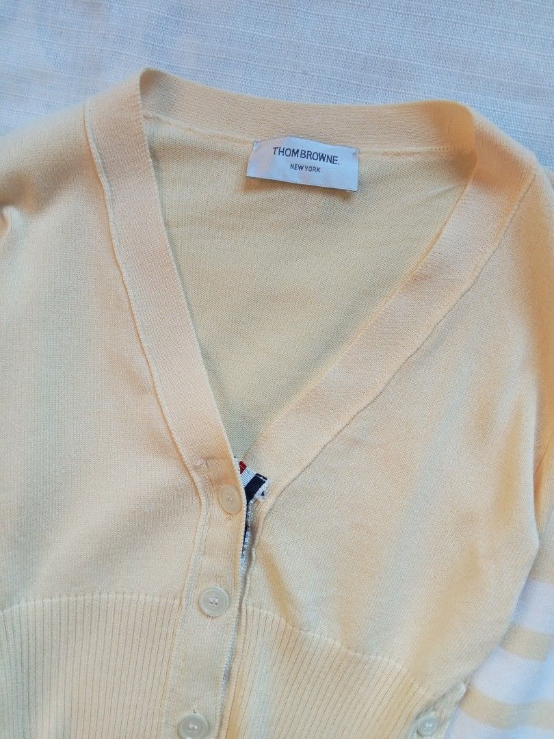 Thom Browne 4 bars pale yellow cardigan (Category: Coats, Jackets and Outerwear) located in Bagabag. Submitted by thrift_stories96 (Listing ID 1469916480, Image 3). Description: Thom Browne 4 bars pale yellow cardigan Small Length - 19.5 Width - 16 stretch up to 17 Condition - excellent No flaw.