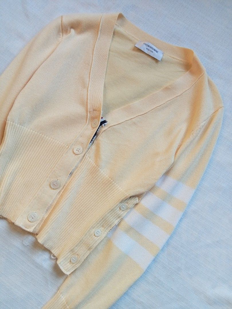 Thom Browne 4 bars pale yellow cardigan (Category: Coats, Jackets and Outerwear) located in Bagabag. Submitted by thrift_stories96 (Listing ID 1469916480, Image 2). Description: Thom Browne 4 bars pale yellow cardigan Small Length - 19.5 Width - 16 stretch up to 17 Condition - excellent No flaw.