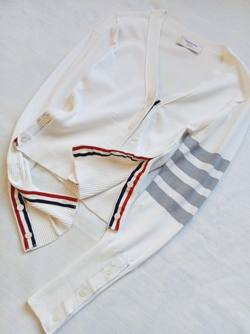 Thom Browne 4 bars white cardigan (Category: Coats, Jackets and Outerwear) located in Bagabag. Submitted by thrift_stories96 (Listing ID 1469915551, Image 2). Description: Thom Browne 4 bars white cardigan Small Length - 19.5 Width - 16 stretch up to 17 Condition - excellent No flaw.