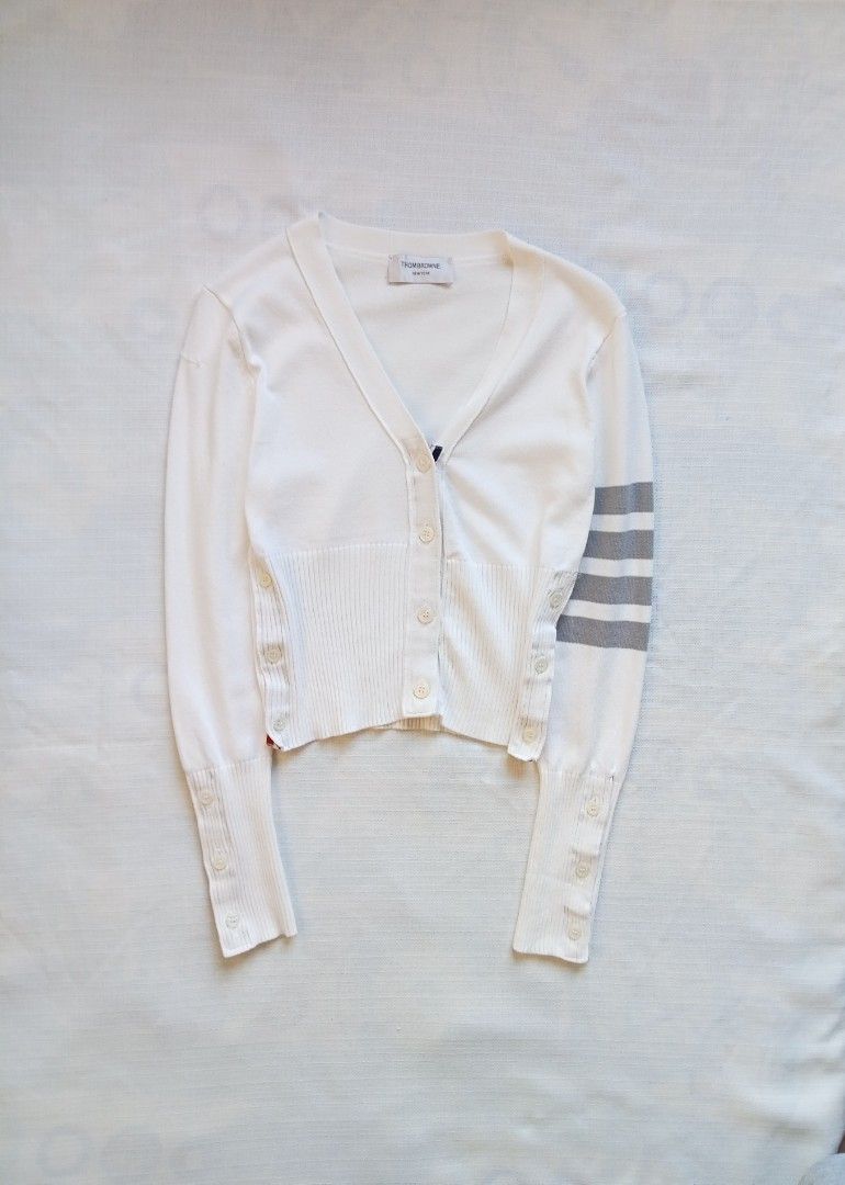 Thom Browne 4 bars white cardigan (Category: Coats, Jackets and Outerwear) located in Bagabag. Submitted by thrift_stories96 (Listing ID 1469915551, Image 1). Description: Thom Browne 4 bars white cardigan Small Length - 19.5 Width - 16 stretch up to 17 Condition - excellent No flaw.