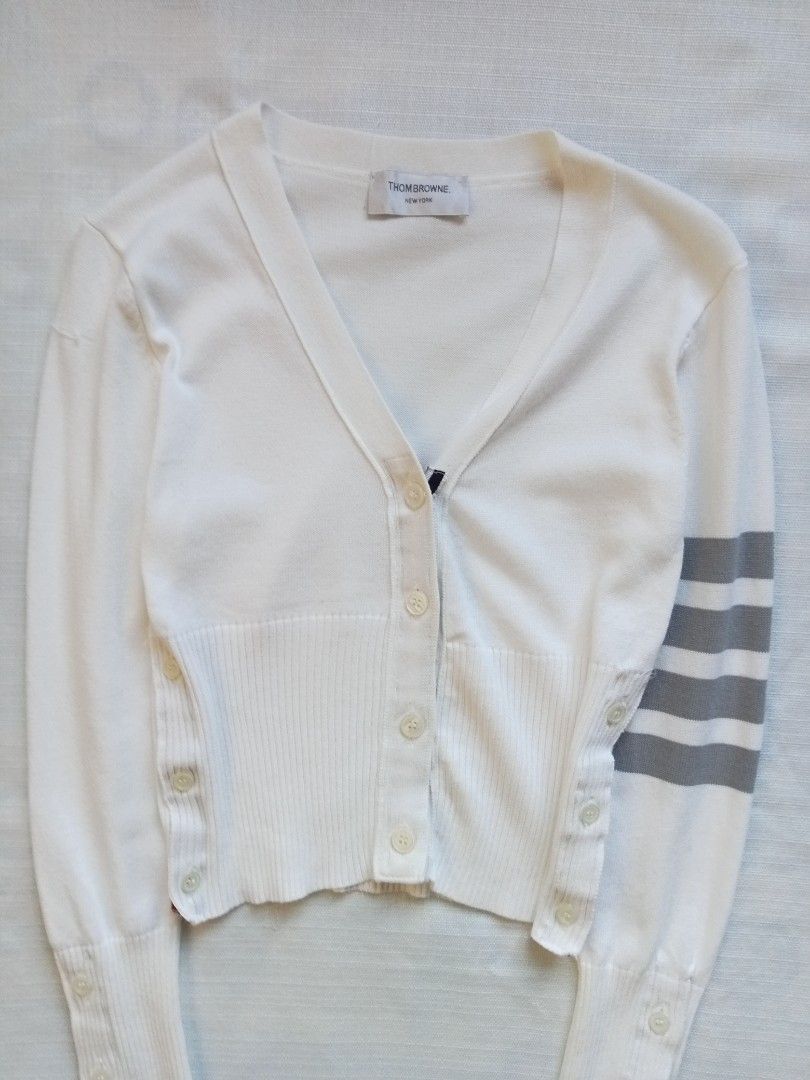 Thom Browne 4 bars white cardigan (Category: Coats, Jackets and Outerwear) located in Bagabag. Submitted by thrift_stories96 (Listing ID 1469915551, Image 3). Description: Thom Browne 4 bars white cardigan Small Length - 19.5 Width - 16 stretch up to 17 Condition - excellent No flaw.