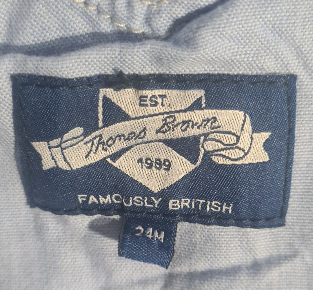 Thomas Brown Blue Striped Guard Overalls 24M (Category: Babies & Kids Fashion) located in Marikina City. Submitted by reloved.closet26 (Listing ID 1469816435, Image 2). Description: Authentic Thomas Brown "Famously British" baby overalls / dungarees. Features a classic blue and white vertical stripe pattern with a detailed embroidered royal guard design on the front pocket..