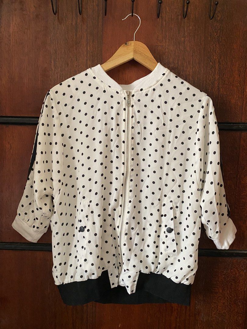 [THRIFTED & AVAILABLE] Polka Dot Bomber Jacket (Category: Coats, Jackets and Outerwear) located in Quezon City. Submitted by yaku1t (Listing ID 1469760225, Image 2). Description: SHIPPING FROM QUEZON CITY. Kindly, read the caption and the bio for some house rules. Swipe right for the close-up pictures. Item is thrifted, please, manage expectations. - White with all-over black polka dots - Design: Sporty black stripes down the sleeves - Closure: Z