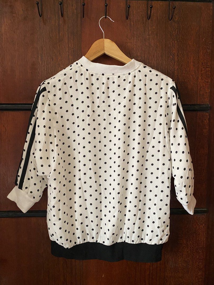 [THRIFTED & AVAILABLE] Polka Dot Bomber Jacket (Category: Coats, Jackets and Outerwear) located in Quezon City. Submitted by yaku1t (Listing ID 1469760225, Image 3). Description: SHIPPING FROM QUEZON CITY. Kindly, read the caption and the bio for some house rules. Swipe right for the close-up pictures. Item is thrifted, please, manage expectations. - White with all-over black polka dots - Design: Sporty black stripes down the sleeves - Closure: Z
