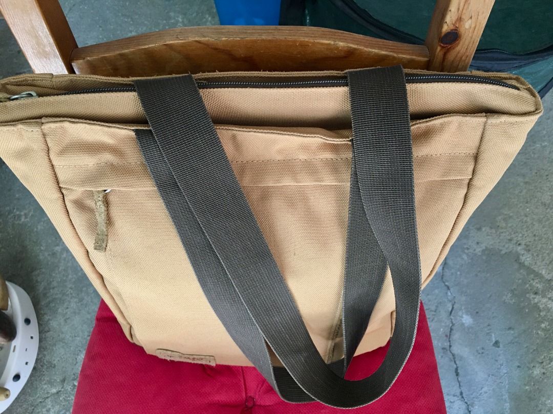 Timberland Canvas Tote Bag Brown Tan (Category: Tote Bags) located in Calamba. Submitted by marjoh29436 (Listing ID 1469844967, Image 2). Description: - Authentic Timberland canvas tote bag in a stylish tan and brown colorway - Secure zipped main compartment to keep your daily essentials safe - Handy front zipper pocket for quick-access items - Sturdy webbed shoulder straps for comfortable everyday carry - Durable textured fabric with a reinforce