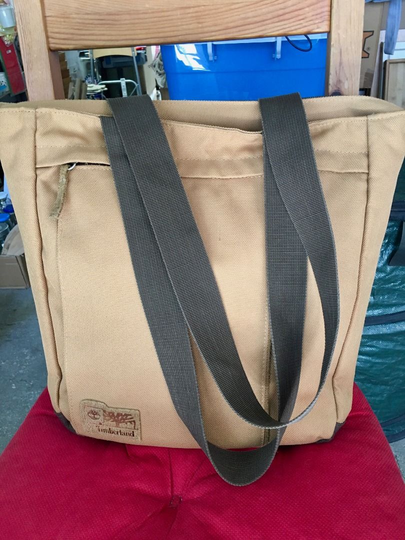 Timberland Canvas Tote Bag Brown Tan (Category: Tote Bags) located in Calamba. Submitted by marjoh29436 (Listing ID 1469844967, Image 3). Description: - Authentic Timberland canvas tote bag in a stylish tan and brown colorway - Secure zipped main compartment to keep your daily essentials safe - Handy front zipper pocket for quick-access items - Sturdy webbed shoulder straps for comfortable everyday carry - Durable textured fabric with a reinforce