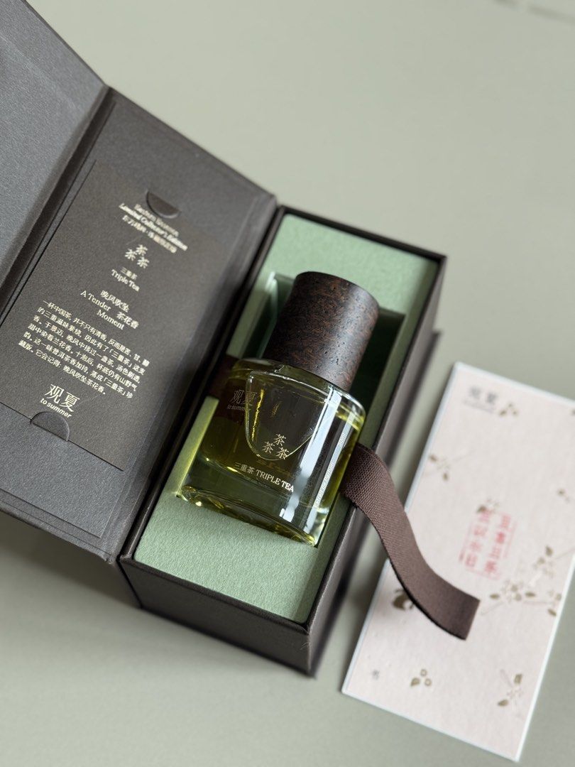 To Summer Eastern Essence Triple Tea Extrait de Parfum 30ml (Category: Fragrance & Deodorants) located in Quezon City. Submitted by preloved4ever_ (Listing ID 1469901108, Image 1). Description: - Brand/Model: To Summer Triple Tea Extrait de Parfum (Eastern Essence Limited Collector's Edition) - Size: 30ml - Fragrance Notes: Rich tea and floral notes - Packaging: Dark green glass bottle with dark wooden cap, nestled in a custom brown gift box with