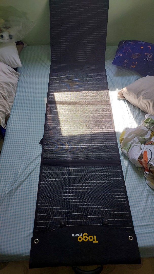 Togo Power Foldable Solar Panel 87x21 inch (Category: Home Improvement Tools & Accessories) located in Baliuag. Submitted by papa.gardz (Listing ID 1469895411, Image 3). Description: - Brand: Togo Power Portable Solar Panel - Size: 87 x 21 inches fully opened - Design: Folds into a compact carrying case with sturdy handle and buckle closures - Connectivity: Includes multiple cables and adapter tips (Anderson, DC plugs) for various power stations 