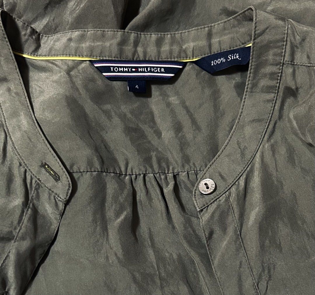 TOMMY HILFIGER (Category: Blouses) located in Davao. Submitted by sart0ria85 (Listing ID 1469780432, Image 3). Description: Mandarin collar with front button closure long sleeves in Military Olive Green and gathered back yoke, and button cuffs. Dry clean only. 100% SILK MADE IN CHINA 🇨🇳 SMALL. Size 4 EXCELLENT CONDITION (92/100).