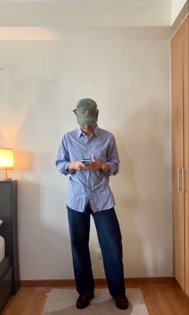 Tommy Hilfiger - Blue Button down shirt (Category: Tshirts & Polo Shirts ) located in Manila. Submitted by foundgoods00 (Listing ID 1469897063, Image 2). Description: Laid-back top. Work fit or casual, it works. Large to XL. My height is 5’8 Good condition. No issue..