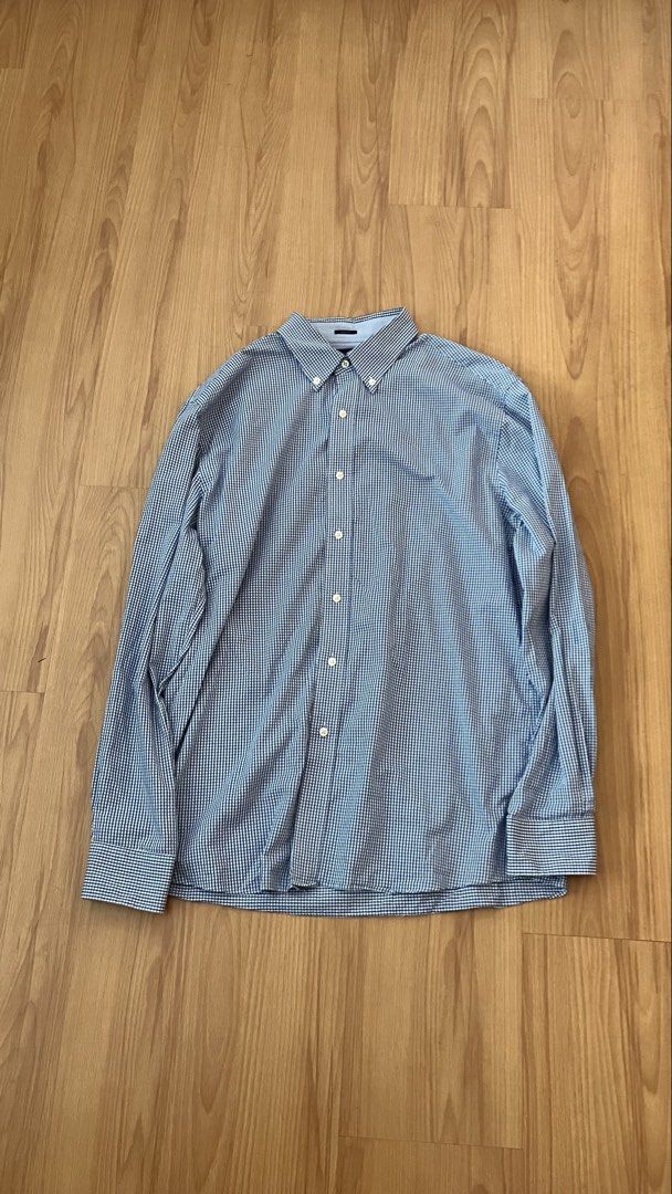 Tommy Hilfiger - Blue Button down shirt (Category: Tshirts & Polo Shirts ) located in Manila. Submitted by foundgoods00 (Listing ID 1469897063, Image 1). Description: Laid-back top. Work fit or casual, it works. Large to XL. My height is 5’8 Good condition. No issue..