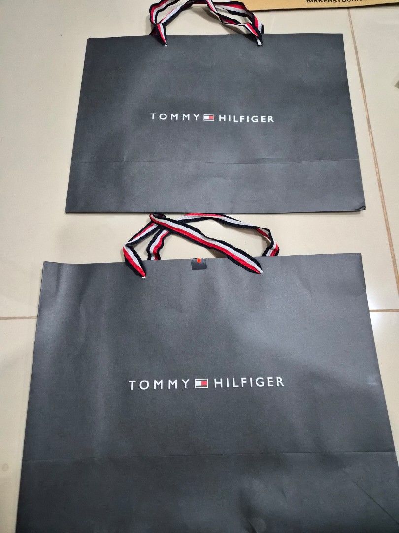 Tommy Hilfiger Paper Bag (Category: Everything Else Others) located in Paranaque City. Submitted by lovelife.312 (Listing ID 1469842383, Image 2). Description: ***PLEASE READ CAREFULLY*** - 2 pieces Medium size paper bag - decluttering room MAILING AND DELIVERY: - Meet up only SM City Sucat, Uptown Mall BGC and Ayala Malls by the Bay. - After lunch time 1pm onward. - If you prefer delivery, buyer will book courier and shoulder shipping fee. MOP: 