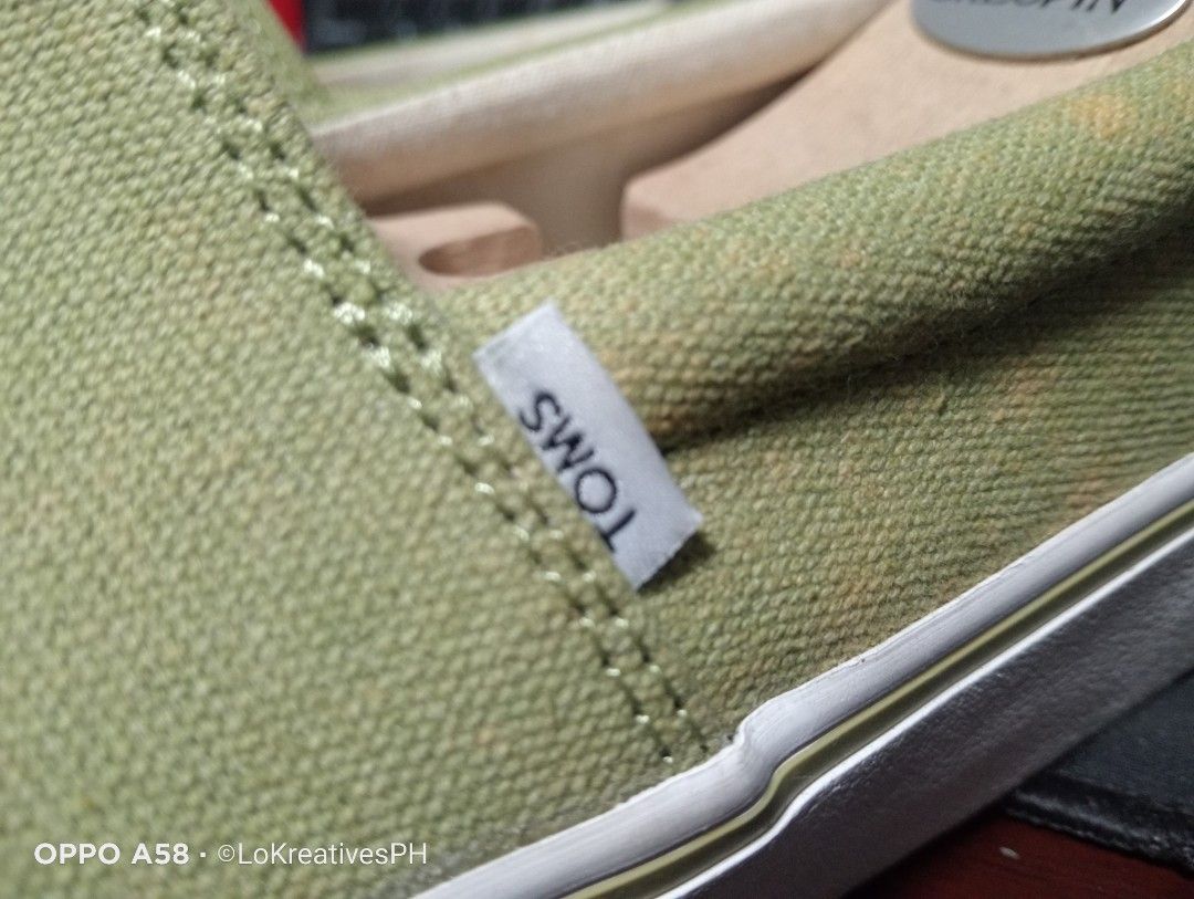 Toms Alpargata Fenix Slip On (Category: Casual Shoes) located in Cavite. Submitted by purpose_served (Listing ID 1469944176, Image 3). Description: Brand: TOMS Style: Alpargata Fenix Slip On Color / Material: Cedar Green Washed Canvas Item Number: 10017879 US Size: 8.0 mens/9.5 womens Things to know: User once, too narrow, sakit sa paa. With box but deformed already. The shoe has discolorations (Please see photos). What's included: - Pairs of sho