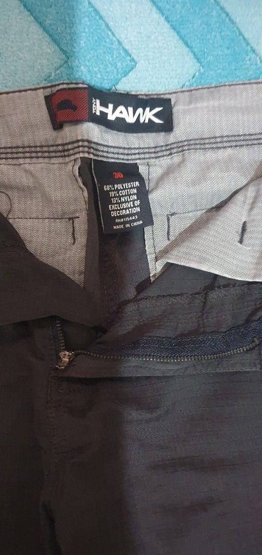Tony Hawk Cargo Shorts Size 30 Brown (Category: Shorts) located in Manila. Submitted by koneho311 (Listing ID 1469806655, Image 3). Description: - Brand: Tony Hawk - Color: Dark Brown - Size: Waist 30 - Material: 68% polyester, 19% cotton, 13% nylon - Fabric: Durable ripstop texture - Features: Multiple side utility pockets, button and zip fly closure, branded interior waistband lining - Condition: Excellent, message for inquiries.
