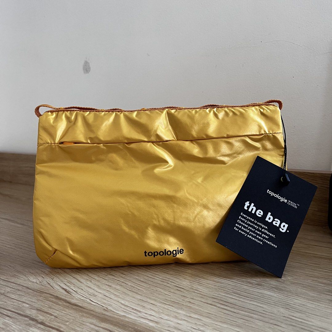 Topologie Bag (Metallic Yellow) (Category: Sling Bags) located in Manila. Submitted by mrnduque (Listing ID 1469836925, Image 1). Description: Not my type. Can fit an iPad mini. Shipping fees will be shouldered by the buyer..