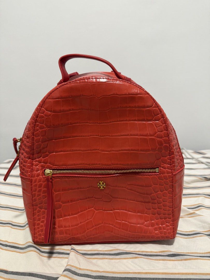 Tory Burch Perry Croc-Embossed Backpack in Red (Category: Luxury Bags & Wallets) located in Iloilo. Submitted by lorenzoivan (Listing ID 1469765001, Image 1). Description: PRELOVED: Tory Burch Perry Croc-Embossed Backpack in Red - ₱6,000 SRP: $500 / ₱31,000 LEGIT/AUTHENTIC: product only in good condition Flaws: hard to zip little weak structure Asking for ₱6,000 (NEGOTIABLE) Pre-owned prices range from ₱7k-₱10k DM for more inquiries and more pics