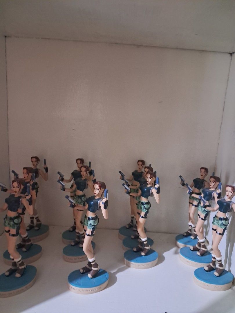 Toy (Category: Vintage Collectibles) located in Cavite. Submitted by secretjapansurplus (Listing ID 1469796313, Image 3). Description: • Iconic Retro Design: Features Lara in her classic dark crop top and green camouflage shorts. • Dual-Wielding Pose: Ready for action, holding her signature dual pistols. • Display Ready: Stands securely on a clean, blue circular base. • Perfect Size: Measures 6 inches tall, making it an ideal piece for your gamin