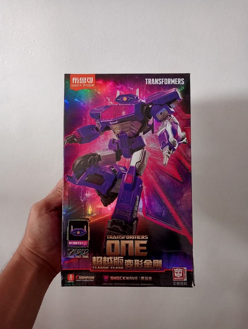 Transformers One Shockwave Classic Class (Category: Action & Battle Toys) located in Muntinlupa City. Submitted by mcnigel84 (Listing ID 1469855359, Image 1). Description: - Official licensed Transformers One Shockwave action figure model kit - Made by Yolepark (Classic Class Champion series) - Features striking purple character design - Comes complete with weapons and a display base - Unbuilt runner parts included inside the box - Slightly dent 