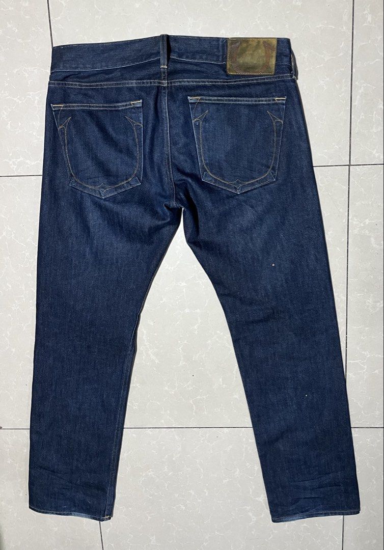 True Religion Geno (Category: Jeans) located in Cebu City. Submitted by rockall24455 (Listing ID 1469909421, Image 1). Description: - Brand: True Religion - Style: Dark wash denim jeans with standard straight leg fit - Origin: Made in USA - Size: Tagged Size 36 on interior label - Closure: Button fly - Details: Classic horseshoe back pocket stitching and leather back patch - Condition: Clean denim fabric, ready to wear.