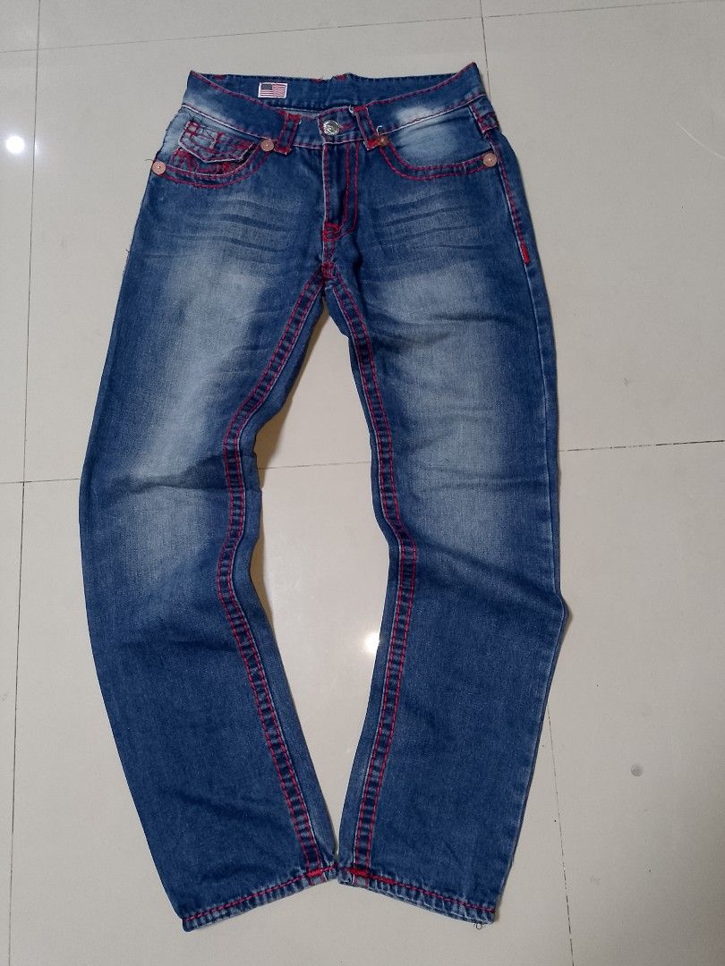 True Religion Joey Super T Jeans (Category: Jeans) located in Manila. Submitted by mjthrifted_second (Listing ID 1469824263, Image 2). Description: - Brand/Model: True Religion Joey Super T jeans -Actual Size: 32/42 - Color: Classic blue denim with bold red stitching - Details: Signature flap back pockets with horseshoe design, button closure, and belt loops - Origin: Made in USA - Condition: Great addition to any casual wardrobe.