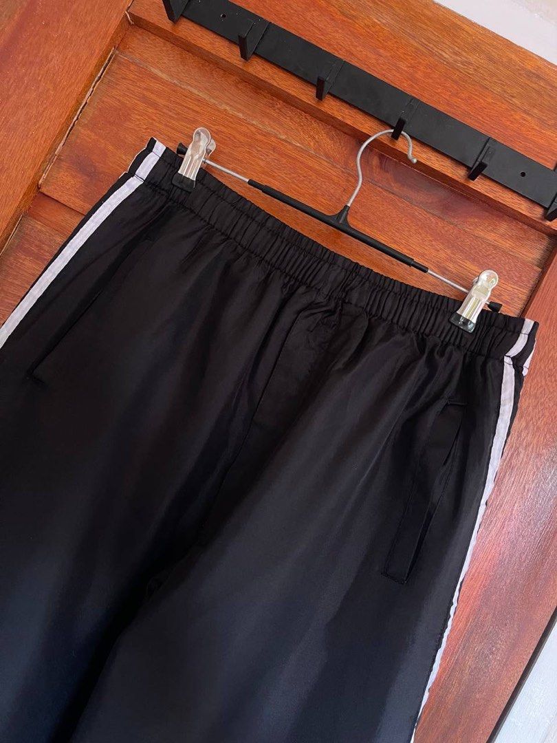 Two lines Track Pants (Category: Activewear) located in San Luis. Submitted by revibeee (Listing ID 1469804707, Image 3). Description: FOR SALE TWO LINES TRACK PANTS WITH DRAWSTRING AND SIDE POCKETS COLOR BLACK WITH WHITE LINES IN EXCELLENT CONDITION COLOR RATE 9/10 CAN FIT SIZE 25 TO 35 WAISTLINE LENGTH 40.5 INCHES UNISEX STRETCHABLE GARTERIZED WAIST WITH MINIMAL FLAWS KINDLY CHECK THE PHOTOS FOR THE COMPLETE DETAILS SUPER NICE IN ACTUAL THICK I