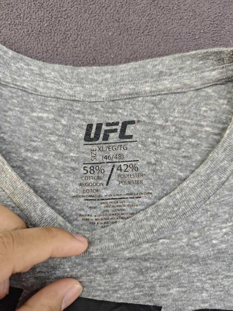 UFC Grey T-Shirt Size XL (Category: Tshirts & Polo Shirts ) located in Bulacan. Submitted by pzj_thrift (Listing ID 1469797691, Image 2). Description: condition 9/10 color rate 9/10 no issue.
