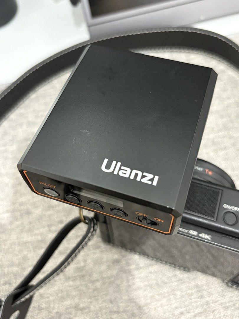 Ulanzi F12 Mini Camera Flash Speedlite GN12 (Category: Flashes) located in Makati City. Submitted by micromermaid23 (Listing ID 1469768772, Image 3). Description: - Brand: Ulanzi F12 Mini Camera Flash Unit - Output: GN12 power for bright, portable lighting - Color Temperature: 5600K CCT for natural daylight look - Compatibility: Fits standard hot shoe mounts (Sony and more) - Controls: Easy-to-use rear buttons, pilot button, mode selection, and o