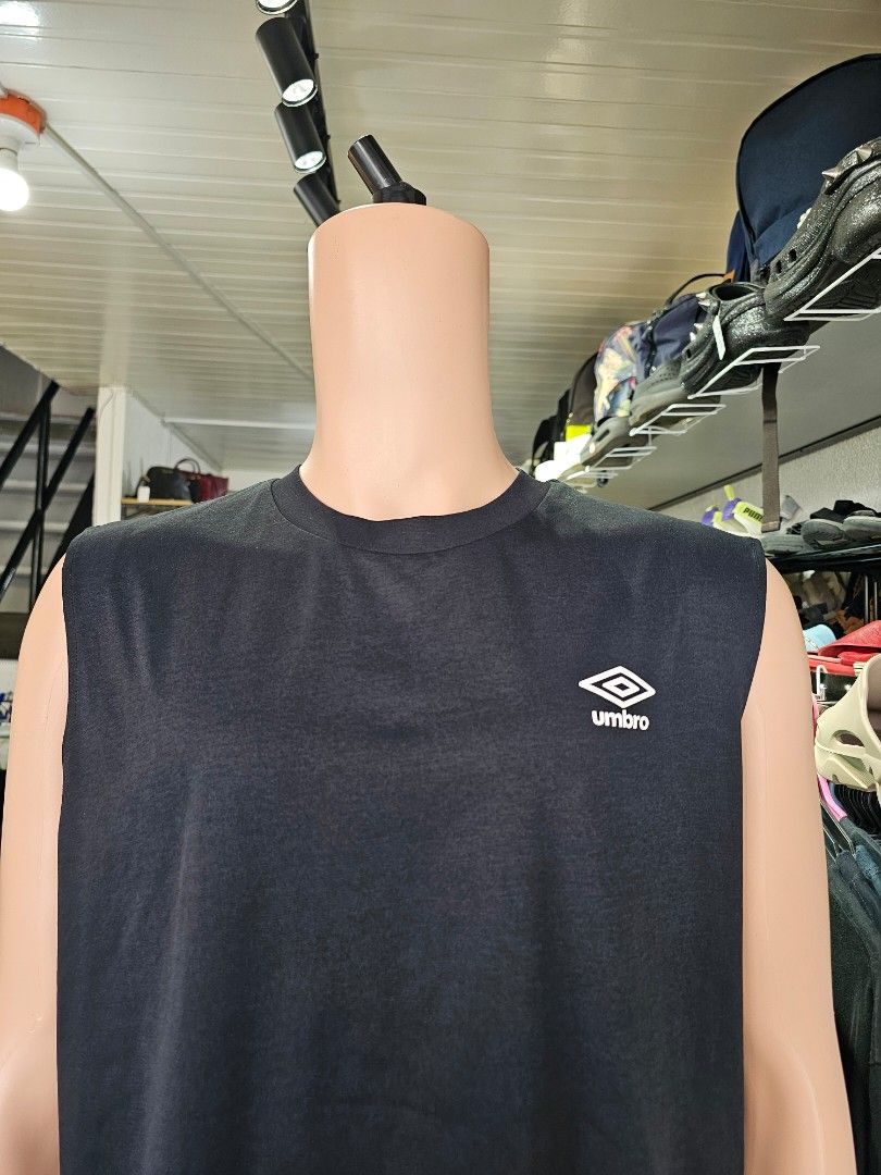 Umbro sleeveless athletic tank top (Category: Tshirts & Polo Shirts ) located in Baguio. Submitted by kayeonlineshop (Listing ID 1469819860, Image 3). Description: black Umbro sleeveless athletic tank top featuring the brand's double-diamond logo on the chest, similar to the Umbro Quick-Dry Muscle Fit Sleeveless T-shirt or performance base layer..