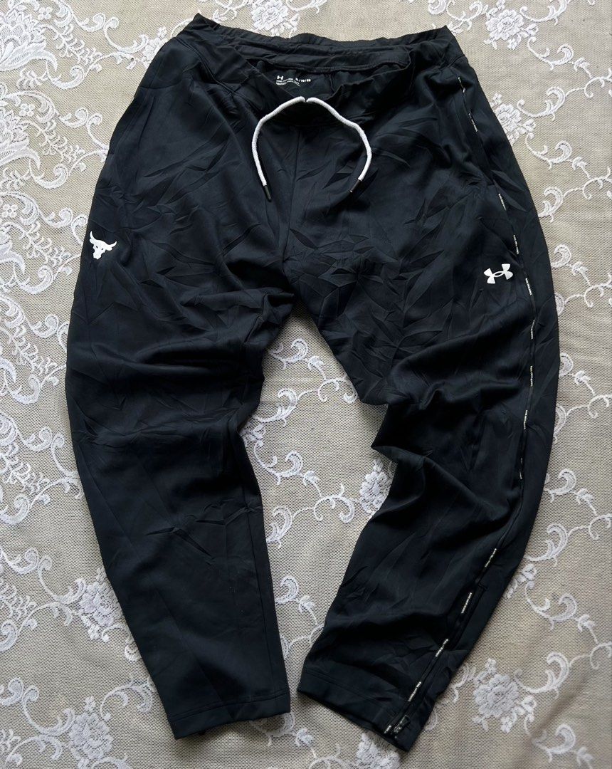 Under Armour Project Rock Black Track Pants XL (Category: Joggers) located in Manila. Submitted by trustedmichael. (Listing ID 1469801033, Image 1). Description: Under armour pants excellent W 36-40 L 42 Leg opening 8 with Zip both side Excellent - Brand: Under Armour Project Rock - Color: Black - Size: XL - Fit & Comfort: Elastic waistband with white drawstring, side pockets, and zip ankle cuffs - Design: Subtle abstract fabric pattern with Proj