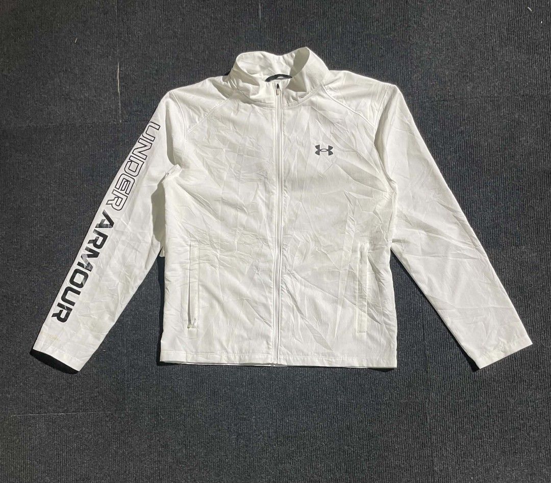 Under Armour White Zip-Up Jacket (Category: Coats, Jackets and Outerwear) located in Cebu City. Submitted by jahfindstreetwear (Listing ID 1469886732, Image 2). Description: UNDER ARMOUR STORM RUN JACKET Size Small W19 L24.5 Goodasnew No issue DM📩.