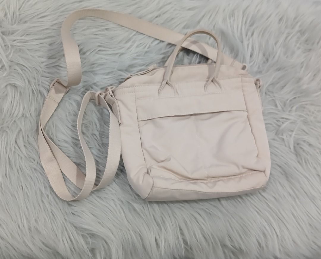 UNIQLO 2-Way Utility Mini Bag (Category: Cross-body Bags) located in Pasig City. Submitted by chinTM (Listing ID 1469777418, Image 1). Description: - Color: Neutral beige - Material: Durable nylon. Water-repellent finish protects against light rain. - Versatile carry: Dual top grab handles and adjustable long shoulder strap - Size: W: 6.7inch, H: 7.5inch, Depth: 3inch, Shoulder Strap Length: 30.7inch~54.3inch - Bag Capacity: 3Liters - Ideal for: 