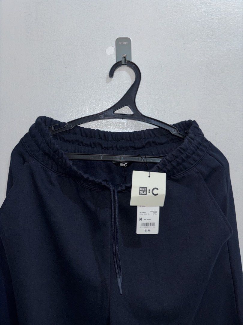 Uniqlo :C Sweatpants Navy Size M (Category: Joggers) located in Cuyapo. Submitted by mn.finds (Listing ID 1469787828, Image 3). Description: - Brand: Uniqlo:C Collection - Item: Sweatpants - Color: Dark Navy - Size: Medium (Waist 76-84cm) - Condition: Brand new with original store tags - Features: Elastic waistband with adjustable drawstring and side pockets.