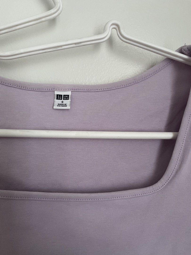 Uniqlo Lilac Top (Category: Sleeveless) located in Lapu Lapu. Submitted by alexisdeclutters (Listing ID 1469788079, Image 2). Description: - Brand: Uniqlo - Color: Pastel purple - Size: Small - Material: Ribbed cotton - Design: Square neckline with short sleeves - Condition: Great, clean inside and out - Style: Versatile basic piece, perfect for high-waisted jeans or skirts.