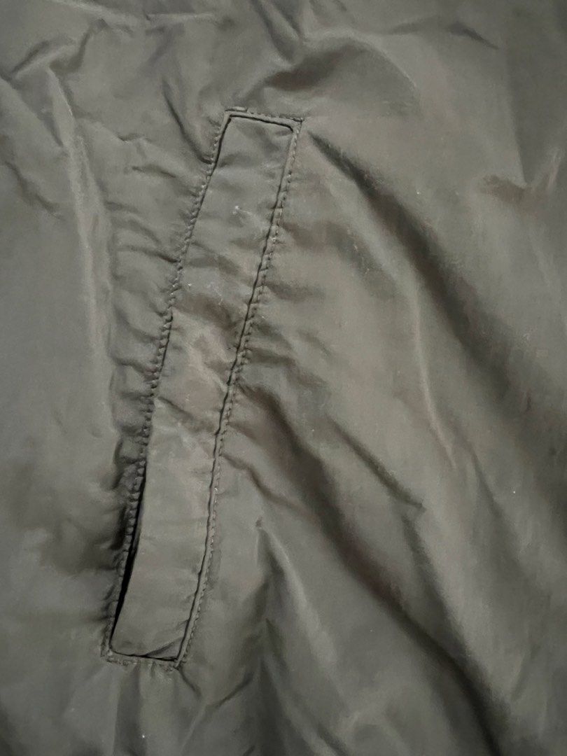 Uniqlo Olive Green Bomber Jacket Size M (Category: Coats, Jackets and Outerwear) located in Muntinlupa City. Submitted by 09leah77 (Listing ID 1469814815, Image 2). Description: - Brand: Uniqlo - Item: Bomber Jacket - Color: Olive Green (Solid Dark Green) - Size: Medium - Origin: Made in Vietnam - Material: Nylon outer shell, polyester lining - Features: Full front zip closure, two side pockets, ribbed collar, cuffs, and hem - Style: Classic casu