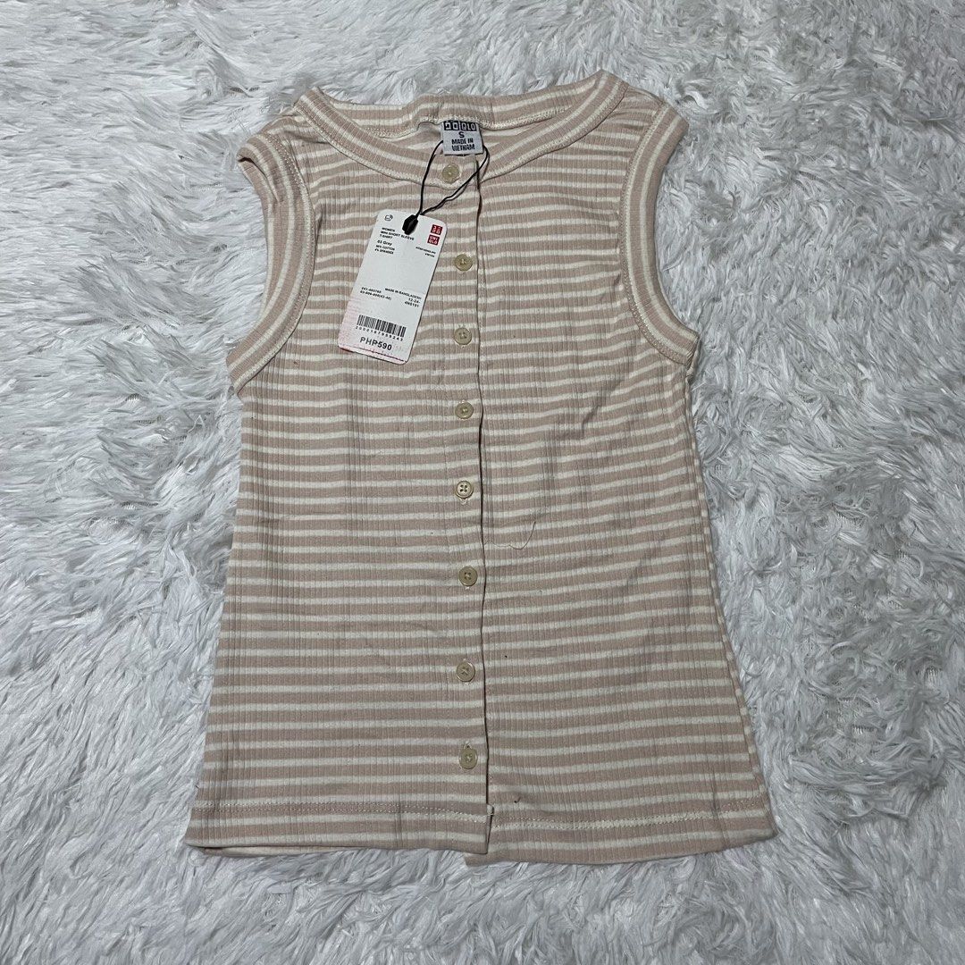 Uniqlo Ribbed Striped Button-Front Tank Top (Category: Sleeveless) located in Batangas. Submitted by strwsherry (Listing ID 1469858233, Image 1). Description: - Brand: Uniqlo - Item: Striped Ribbed Tank Top - Color: Beige and White - Size: S - Condition: Brand new with original tags attached - Features: Sleeveless, scoop neckline, front button placket, soft stretch ribbed fabric.