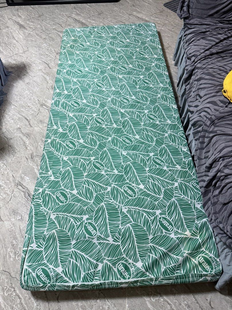 Uratex Foam Mattress Green Leaf Pattern (Category: Bed Frames & Mattresses) located in Calamba. Submitted by nicalison (Listing ID 1469844882, Image 1). Description: - Brand: Uratex foam mattress - Size: Standard single (3.5 inches thick x 75 inches length) - Design: Stylish green and white leaf pattern - Condition: Clean, stain-free, and well-maintained - Comfort: Good thickness, ideal for daily sleeping or lounging - Convenience: Lightweight an