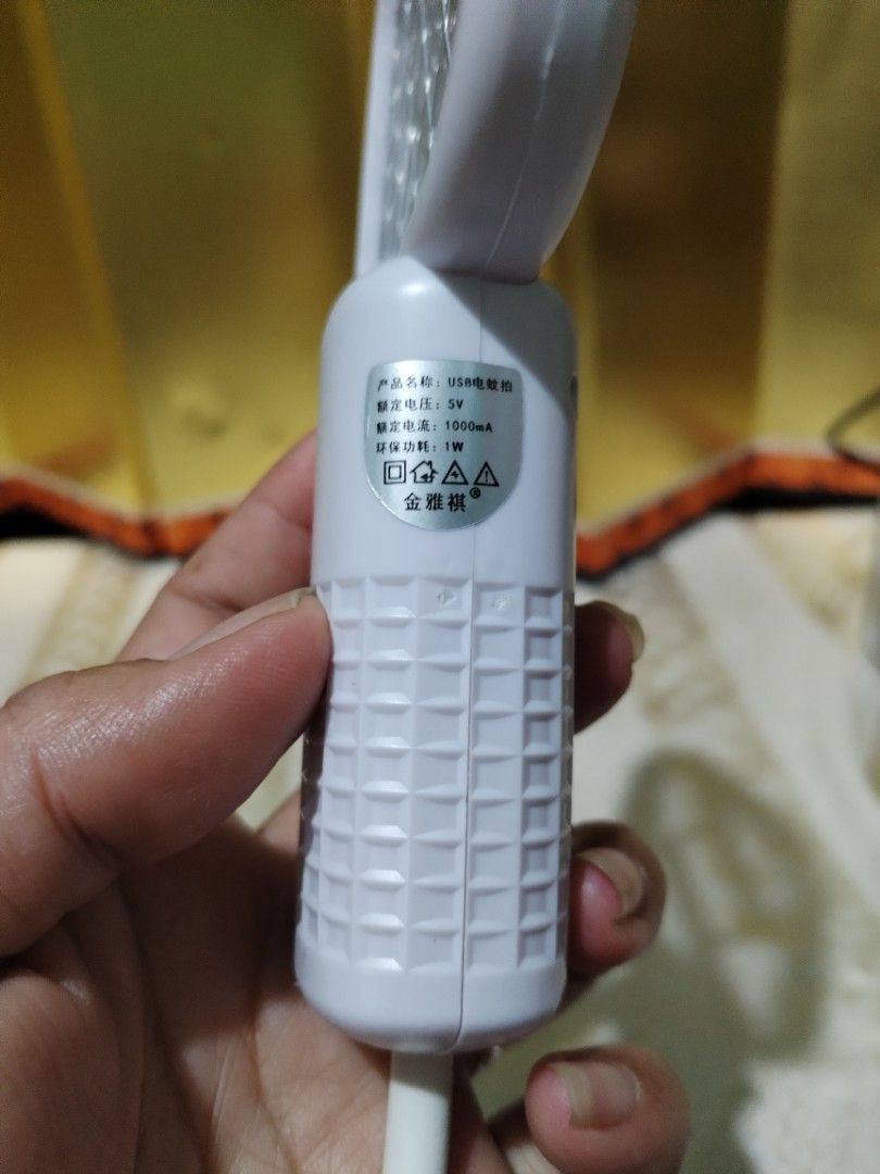USB Electric Mosquito Swatter Trap Bug Zapper (Category: Insect Repellents) located in La Trinidad. Submitted by malditas (Listing ID 1469919538, Image 2). Description: - 2-in-1 Design: Works as a manual swatter or an automatic UV light bug trap - USB Powered: Conveniently plugs into standard USB ports, power banks, or adapters - Effective Night Use: Bright blue UV light attracts and catches mosquitoes in the dark - Compact & Portable: Easy to pa