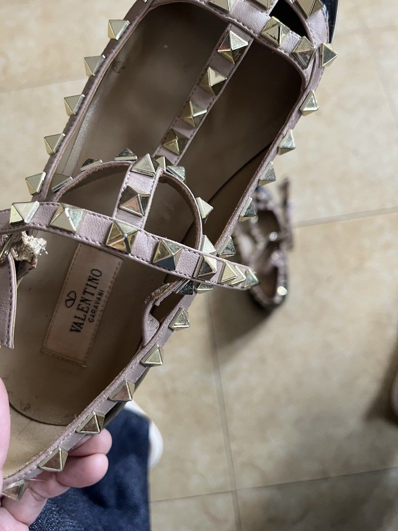 Valentino Garavani Rockstud Pointed-Toe Flats Size 37 (Category: Flats & Sandals) located in Quezon City. Submitted by iamina16 (Listing ID 1469774140, Image 2). Description: - Brand: Valentino Garavani - Style: Rockstud pointed-toe flats - Color: Black and powder pink - Material: Leather with signature pyramid studs and buckled ankle strap - Size: 37 (Made in Italy) - Condition: Soles show clear signs of wear from street use, interior leather li