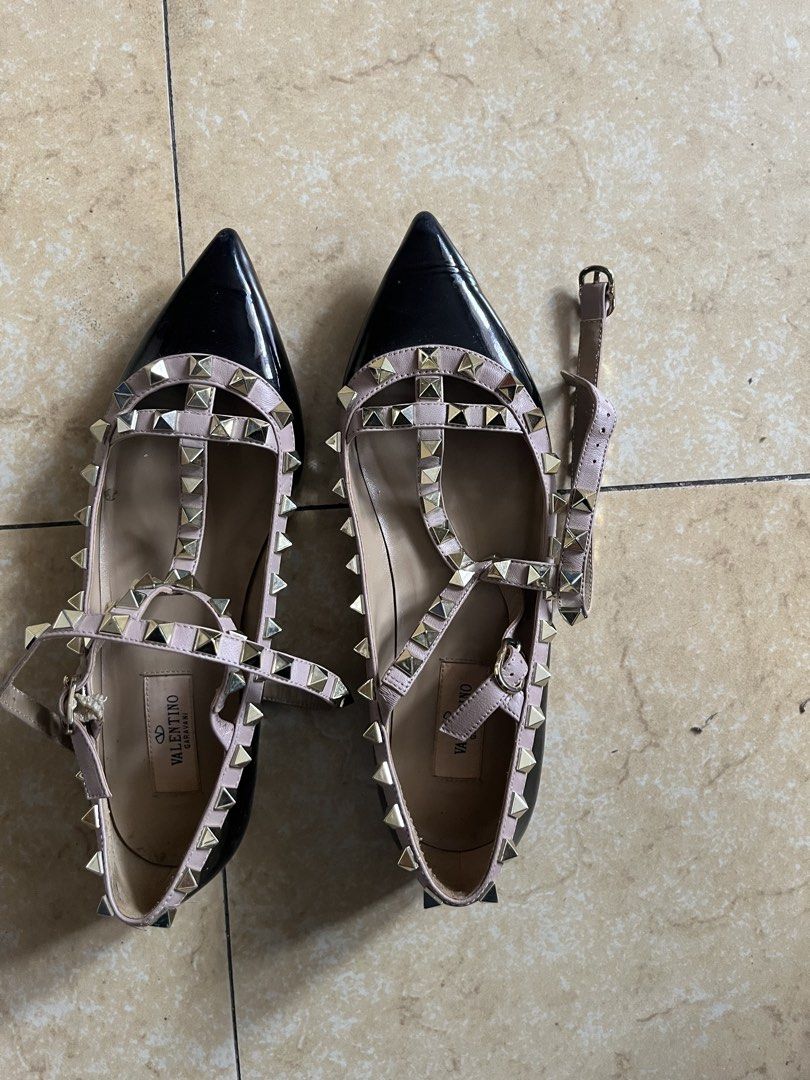 Valentino Garavani Rockstud Pointed-Toe Flats Size 37 (Category: Flats & Sandals) located in Quezon City. Submitted by iamina16 (Listing ID 1469774140, Image 1). Description: - Brand: Valentino Garavani - Style: Rockstud pointed-toe flats - Color: Black and powder pink - Material: Leather with signature pyramid studs and buckled ankle strap - Size: 37 (Made in Italy) - Condition: Soles show clear signs of wear from street use, interior leather li