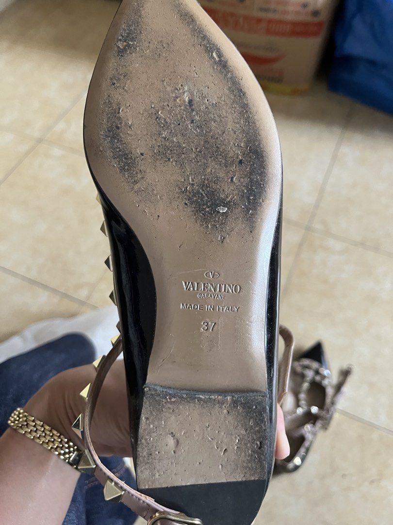 Valentino Garavani Rockstud Pointed-Toe Flats Size 37 (Category: Flats & Sandals) located in Quezon City. Submitted by iamina16 (Listing ID 1469774140, Image 3). Description: - Brand: Valentino Garavani - Style: Rockstud pointed-toe flats - Color: Black and powder pink - Material: Leather with signature pyramid studs and buckled ankle strap - Size: 37 (Made in Italy) - Condition: Soles show clear signs of wear from street use, interior leather li