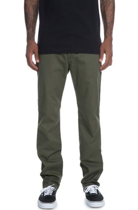 Vans Olive Green Chino Pants Size 30 (Category: Chinos) located in Binalbagan. Submitted by southsidethrift22 (Listing ID 1469891649, Image 1). Description: - Brand: Vans - Style: Olive green chinos, classic straight fit - Size: 30 - Details: Back welt pockets, button closure, branded Vans woven label - Origin: Made in Nicaragua with US fabric - Condition: Clean and ready to wear, featuring minor wear around the seams and a loose thread near the 